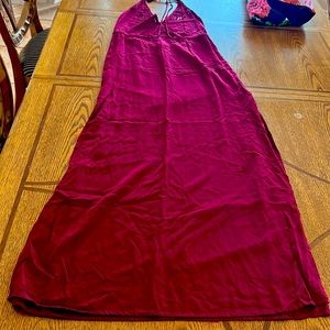 Long cherry dress, halter style, elastic waist, slits on both sides of the legs